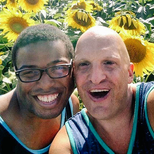 Roy George a sunflower field with best friend, Shawn