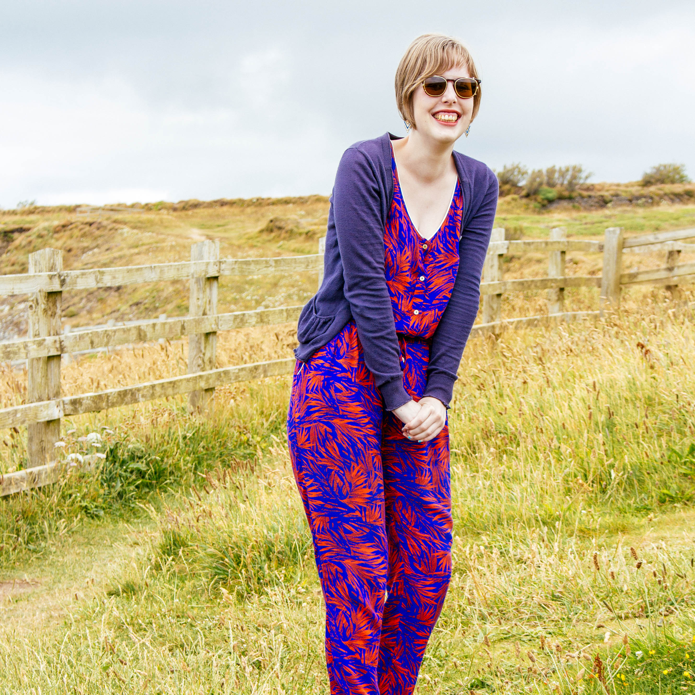 Sarah Frison smiling in a sunny field