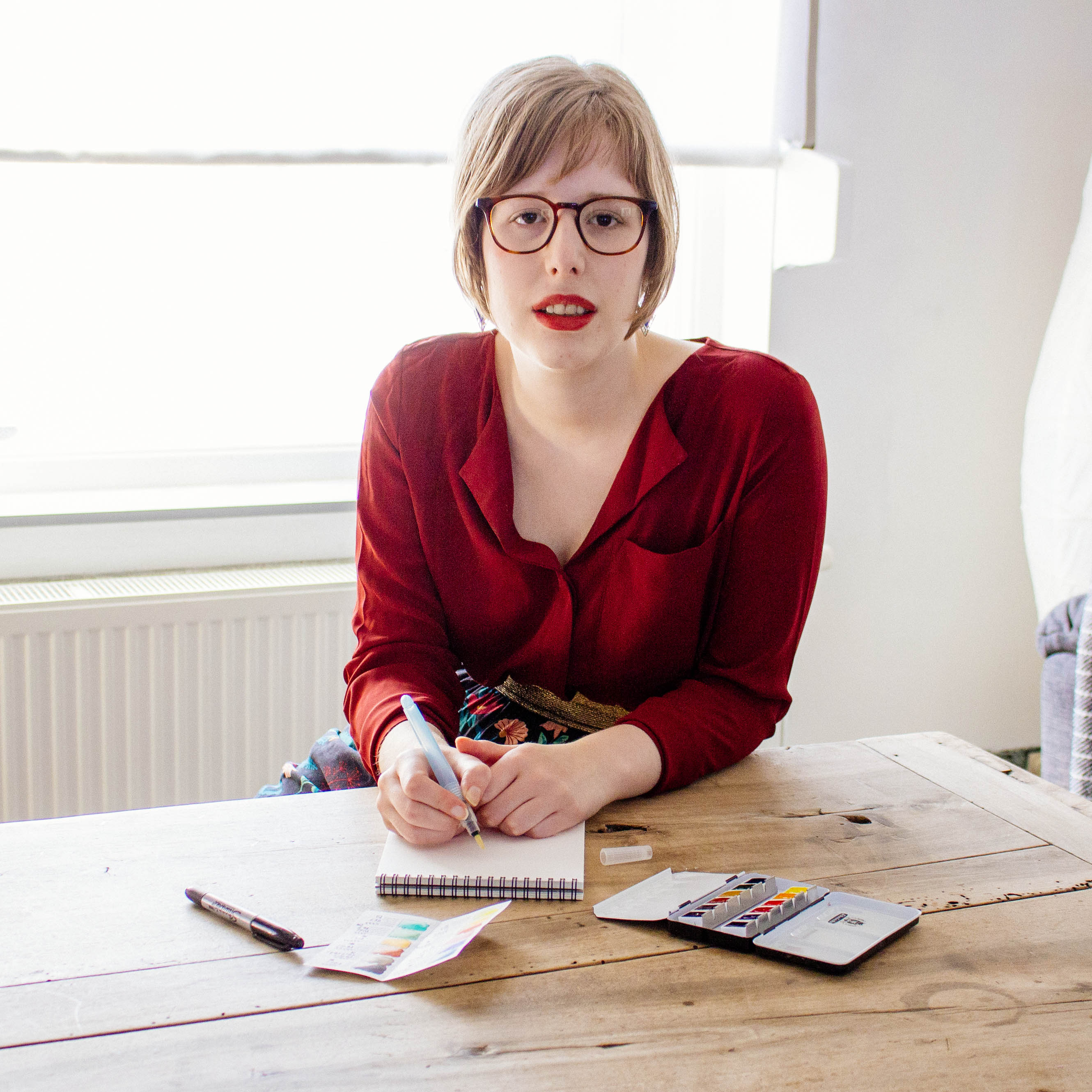 Sarah Frison working at her desk